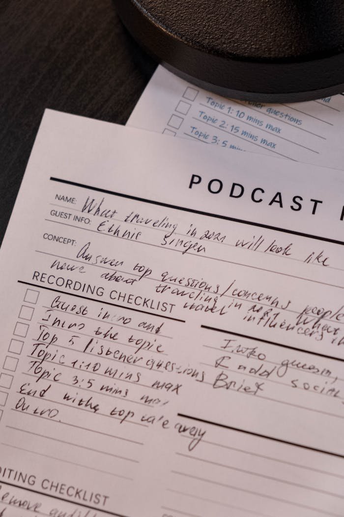 Detailed podcast planning sheet with handwritten notes for effective recording.